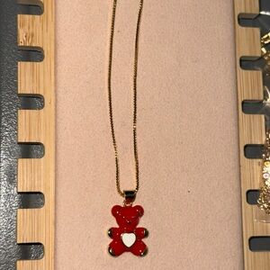 Elegant Gold Necklace with Red Teddy Bear Pendant